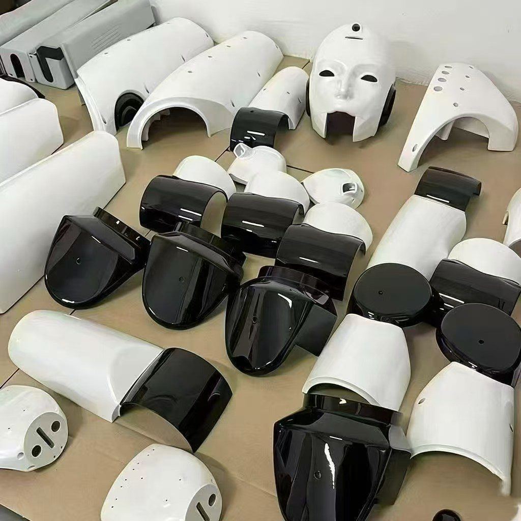 White and black cosmetic robot covers in a batch